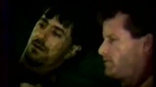 Two straight working men put condoms on