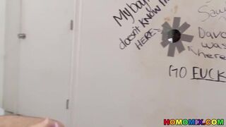 Bearded guy sucking off a black cock at a gloryhole