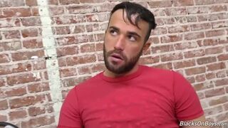 Bearded guy sucking off a black cock at a gloryhole