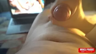 Guy playing with his cock while watching porn
