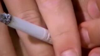 Smoking twink plays with a big butt plug and his fat cock