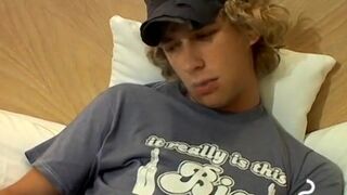 Blonde twink Casey Wood jerks off his dong while smoking