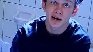 Stud gay Ian Madrox lights up cigar and tugs cock with hand