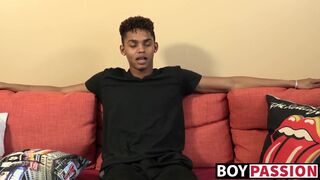 Black young man gives an interview and stimulates himself