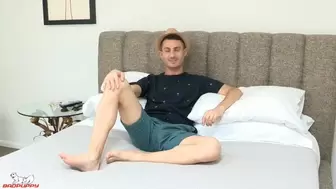 Robbie Caruso pulls his legs back, exposing his tight hole.
