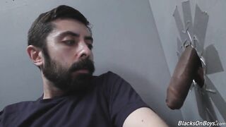 White man sucking and fucking a black cock at a gloryhole