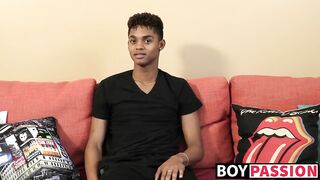 Black young man gives an interview and stimulates himself